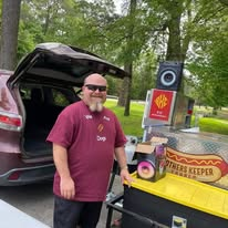 A Brothers Keeper Church volunteer at the food station