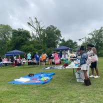 Community outreach activities across a grassy park