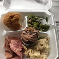 A complete meal prepared for a community guest