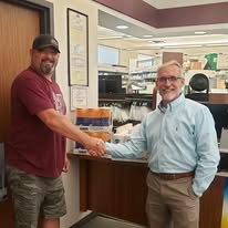 A ministry volunteer thanking a community partner