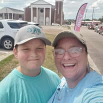 Two smiling volunteers at the church drive-through outreach