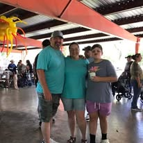 A family serving together at the community outreach