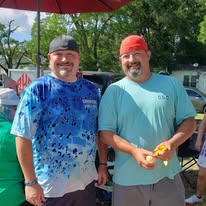 Two volunteers helping with the community food service