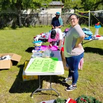 Volunteers arranging free items for community members