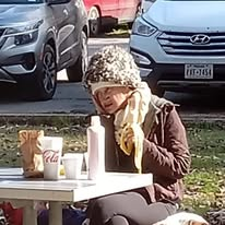 A community guest enjoying a meal outdoors