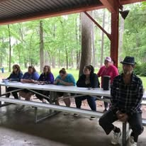 Guests spending time together at a pavilion table