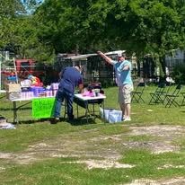 Volunteers preparing community outreach tables