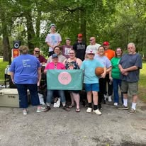 The homeless outreach volunteer team gathered outdoors
