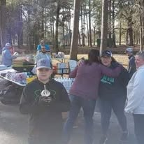 Volunteers serving together at an outdoor outreach