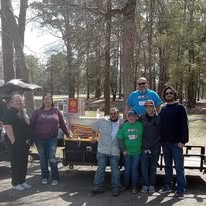 A small outreach team gathered with ministry supplies