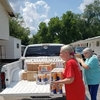 Volunteers organizing supplies for delivery