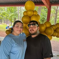Two outreach volunteers standing together