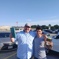Volunteers carrying ministry materials