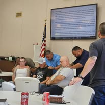 Volunteers praying together before ministry